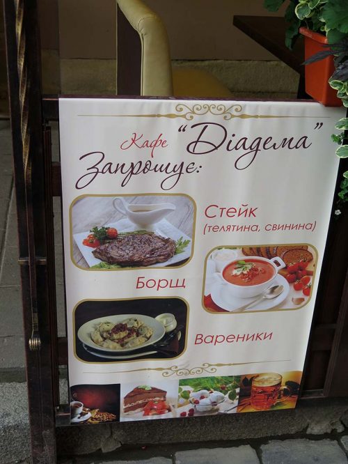 An ad with menu items in front of a cafe.